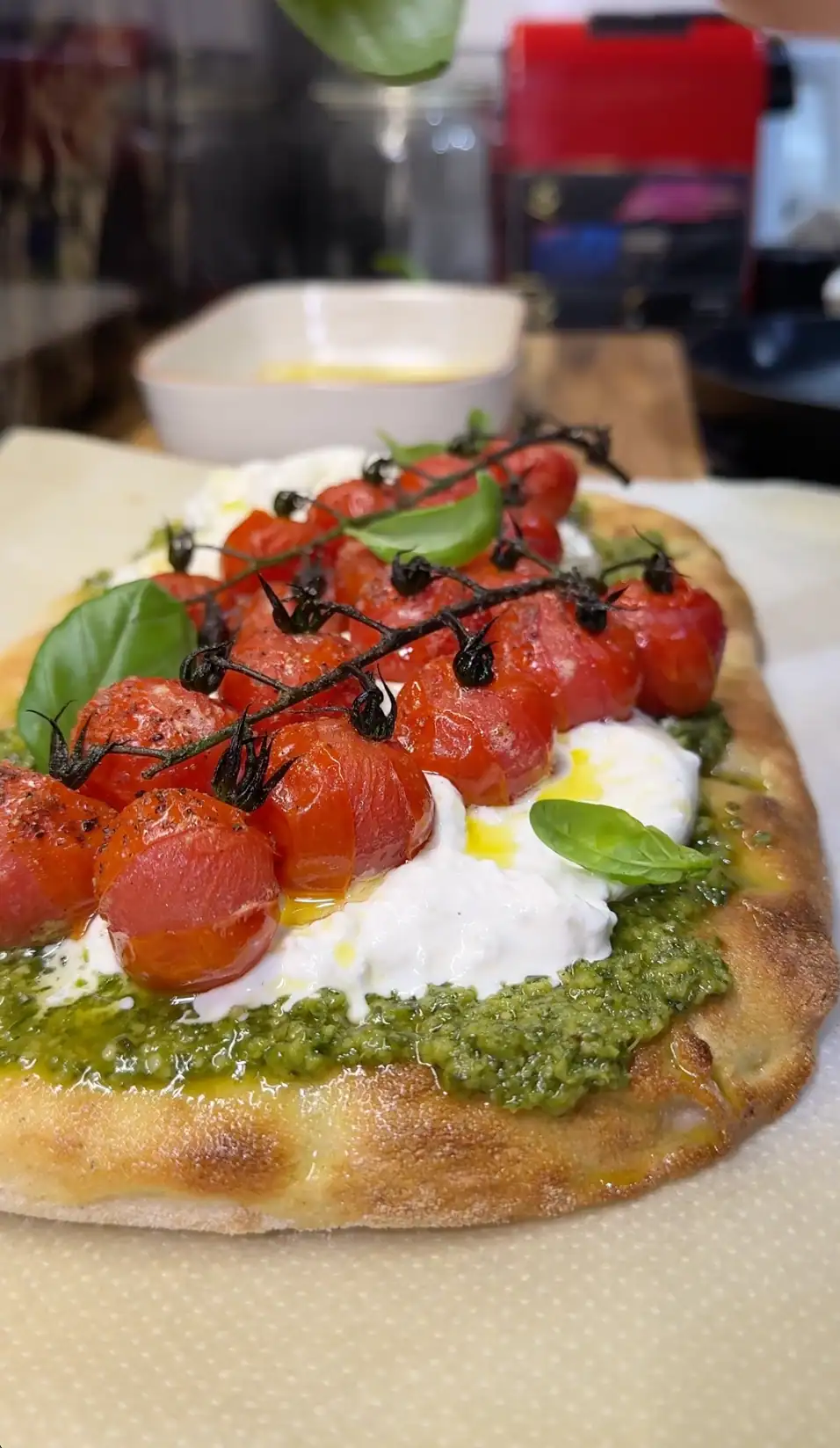 Pinsa with Burrata, Roasted Cherry Tomatoes, and Pesto
